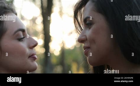 girls french kissing|Two girls french kissing outside at the park. LGBT lesbian couple .